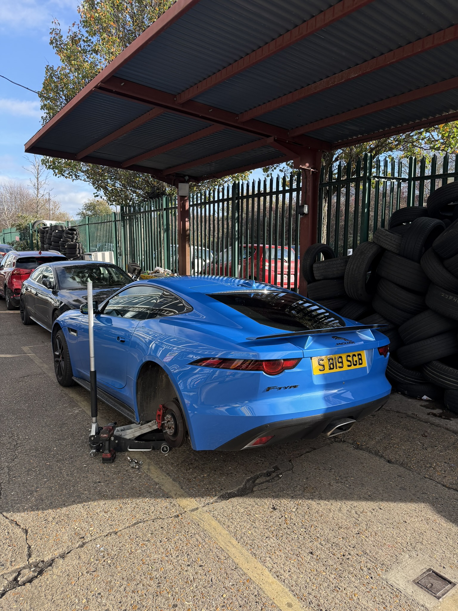 Car on the ramp at My Tyres garage in Thamesmead